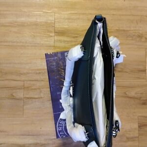 Coach Hunter green Pebble leather satchel with crossbody strap.